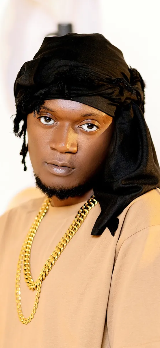 Sama Sojah gold shirt close-up studio portrait